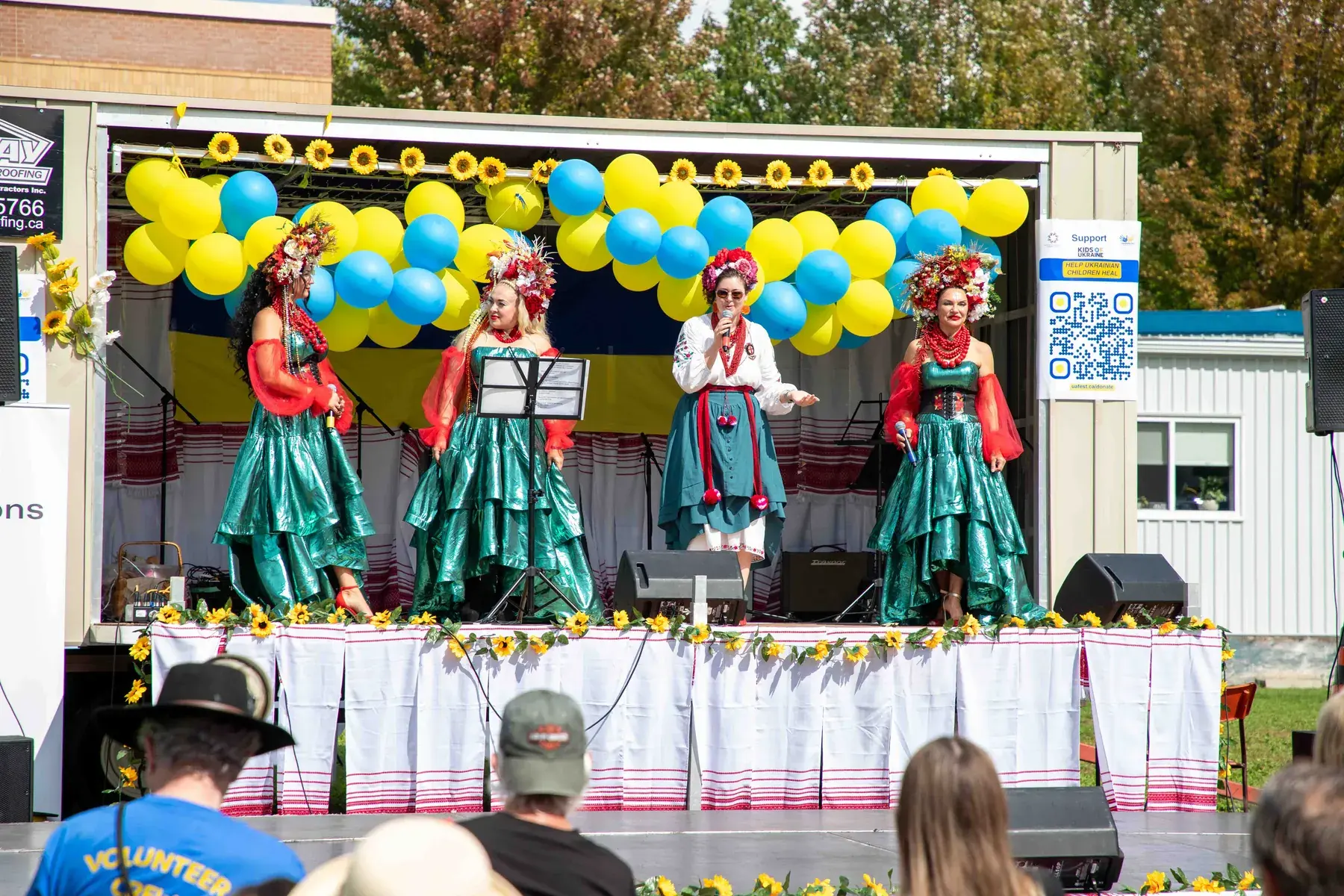Dancers in green dresses and flower wreaths on the UAFest 2026 main stage